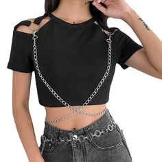 Discover the essence of edgy elegance with our Black Goth Crop Top With Chains. Crafted from high-quality polyester, this top embodies the spirit of grunge, Harajuku fashion, Sacricore, and goth aesthetic trends. Its striking black color and intricate chain details make it a standout piece for those who dare to be different. Free shipping in the US and worldwide. SIZE (CM) S M L LENGTH 34 35 36 SLEEVE 12,5 13 13,5 BUST 72 76 80 SIZE (IN) S M L LENGTH 13,4 13,8 14,2 SLEEVE 4,9 5,1 5,3 BUST 28,4 29,9 31,5 Embrace your unique style with this versatile crop top that combines bold design with comfort. The polyester material ensures durability and a sleek fit, ideal for pairing with high-waisted jeans, skirts, or layered under jackets for a distinctive look. Features stylish chain embellishments Goth Crop Top, Shirt With Chains, Embellished Crop Top, Goth Clothing, High Fashion Outfits, Cotton Crop Top, Harajuku Streetwear, Top Outfit, Blouse Short Sleeve