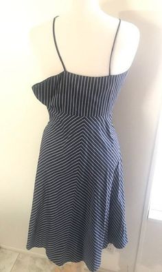 "J Crew Striped Dress, Vintage Navy Blue and White Striped Dress, Fit and Flare Dress, Size 2 Lovely striped skater dress! The color is navy blue and white. Open and close with invisible zipper on the side. The manikin is very big for the size of the dress! This dress is super pretty to wear during spring and summer. In great condition armpit to armpit around: 30\" waist: 30\" length: 34\" Genesis Vintage Shop accept returns and Exchanges! Joy and satisfaction with your item is very important to Casual Sleeveless Dress With Striped Hem, Pinstripe Sleeveless Spring Dress, Pinstripe Sleeveless Dress For Spring, Spring Pinstripe Sleeveless Dress, Black Vertical Stripes Summer Dress, Black Summer Dress With Striped Hem, Striped Sundress For Day Out, Fitted Vertical Stripe Dress For Day Out, Black Casual Dress With Striped Hem