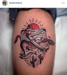 a tattoo on the leg of a man with an image of a cat and cactus