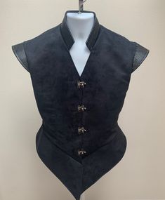 "New adult men's Renaissance Medieval Elizabethan Revolutionary pirate colonial Buccaneer jerkin vest coat robe costume. This stunning professional quality jerkin is a rich black suede fabric. Stand up collar. Front opening with stunning regal silver hooks. Fully lined. New not worn. Back length from shoulder is 24 \". All sales final. Will exchange for a different size. Great for your next theme party, stage production or special event. Small is for a 34\" - 36\" chest with 32\" waist Medium is Medieval Mens Fashion, Fitted Black Costume For Larp, Black Fitted Costume For Larp, Fitted Medieval Black Costume, Black Gothic Vest For Larp, Steampunk Style Black Vest For Costumes, Mens Medieval Clothing, Gothic Black Vest For Costume, Fitted Black Vest For Costume