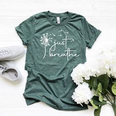 Hi! Just Breathe Shirt , Meditation Thirt, Yoga T-shirt, Relax,  Dandelion Outfit,  Floral Girl Clothes, Positive Svg, Christian Tee, Blessed  Welcome to my store and it's great to see you here! I'm sure you'll love my designs. Please let me know if you have any questions and recommendations. The Unisex t-shirts are retail fit and a little bit relaxed. If you want to have a fitter look, I recommend you order one size smaller. But make sure you check our size-chart before you place your order. Th Green Pre-shrunk Tops For Spring, Green Shirt With Text Print For Spring, Green Comfortable Crew Neck Top, Green Comfortable Fit Crew Neck Top, Green Crew Neck Top With Comfortable Fit, Green Crew Neck Tops, Green Comfortable Cotton Top, Dandelion Outfit, Bachelorette Party Tees