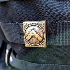 a badge on the back of a backpack