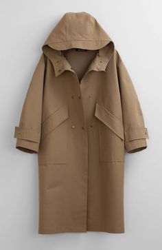 Fabric: 73% Cotton, 27% NylonColor: Light BrownCare: Hand wash / Dry clean Waterproof oversized hooded trench coat with two front pockets and centre front bottom closure. The length is 46-47 inches (118-120 cm). Unlined. Consider wearing at a temperature 68-50°F (20-10°C) Made in USA. Pijamas Women, Khaki Trench, Khaki Trench Coat, Hooded Trench Coat, Waterproof Coat, Hooded Raincoat, Hooded Vest, Cotton Vest, Trench Coat Black