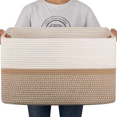 a person holding a mattress in their hands