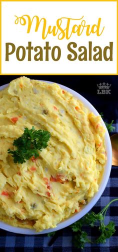 a bowl filled with mashed potato salad on top of a table