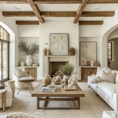 a living room filled with furniture and a fire place in the middle of a room