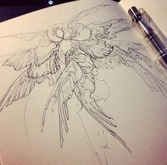 a drawing of a bird with wings and flowers on it's back, next to a pen