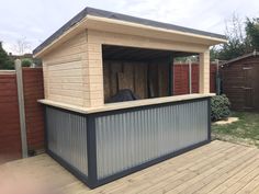 an outdoor storage shed with a horse in it