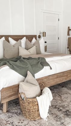 a large bed sitting on top of a rug next to a wooden headboard and foot board