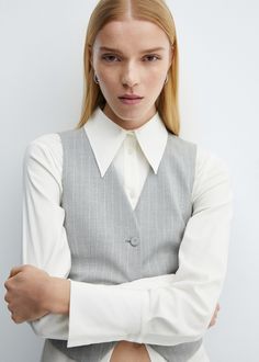 Pinstriped suit vest - Woman | MANGO USA Chic Striped V-neck Vest, Classic V-neck Office Vest, Tailored Pinstripe Vest For Spring, Chic Fitted Pinstripe Vest, Pinstripe Vest For Work, Pinstripe Tailored Sleeveless Vest, Tailored Pinstripe Sleeveless Vest, Tailored Sleeveless Pinstripe Vest, Elegant Striped Vest For Spring