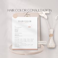 the hair color consuption is displayed next to a vase with flowers in it