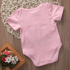 Description: Witty parents are the best that like to have fun in everything and especially dressing their babies in entertaining quoted clothes. The Funny Smell Romper is equally amusing to elders, as it looks adorable on babies. The cotton-made fabric is comfortable to wear and does not cause any irritation to the baby’s skin. The wide neckline and the lap shoulders assist in easy dressing. The snap buttons at the end are convenient for quick diaper changes. The romper could be worn at family g Baby Crib, Easy Dressing, Bridal Shower Gifts, Short Rompers, Simple Dresses, Fabric Cotton, Baby Onesies, Black Pink, Rompers