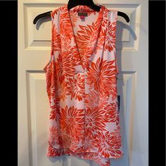 Brand New With Tags. Vince Camuto Chiffon Sleeveless Top In Peach/Coral And White Design. Size Medium. Very Flowy Material For Summertime. Fast Shipping! Fitted Sleeveless Vacation Blouse, Sleeveless Summer Blouse For Vacation, Sleeveless Floral Print Blouse For Beach, Split Blouse, Chiffon Sleeveless Top, Satin Tank Top, Lace Trim Blouse, Floral Print Tunic, Gold Blouse