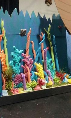 a cake made to look like an ocean scene with corals and sea animals on it