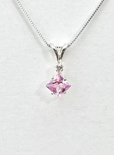 Square pink amethyst has a pink/ lavender color and measures 5.5mm x 5.5mm ( 1 carat). Tiny genuine accent diamond. Both stones were handset in sterling silver. Sterling silver box chain is 18 inches long. Comes in a gift box Pink Diamond Necklace For Formal Occasions, Pink Diamond Dainty Necklace, Dainty Pink Diamond Necklace, Pink Gemstone Pendant Birthstone Necklace, Purple Amethyst Necklace With Diamond Accents, Purple Diamond Necklace With Diamond Accents, Elegant Pink Pendant Birthstone Necklace, Pink Pendant Jewelry With Diamond Accents, Purple Diamond Pendant Necklace