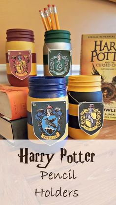 harry potter jars are stacked on top of each other with the words, pencil holders