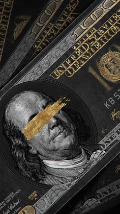 a pile of twenty dollar bills with a gold piece sticking out of it's face