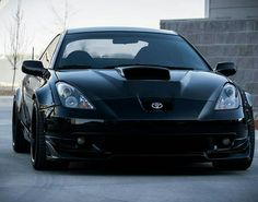 the front end of a black sports car