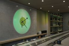 a bowling alley with a clock on the wall