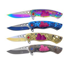 four different colored knives with hearts on them