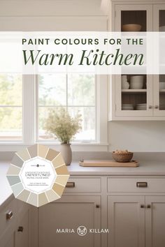 the cover of paint colors for the warm kitchen, featuring white cabinets and counter tops