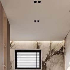 a bathroom with marble walls and flooring next to a bathtub in the corner