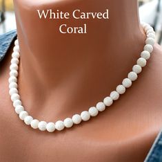 Add an elegant touch to your bridal ensemble with this stunning White Carved Coral Necklace. Crafted with 8mm white carved coral beads, this necklace exudes timeless beauty and sophistication. Perfect for wedding accessories or any special occasion, this coral bead necklace is sure to make you stand out. Handmade with care and finished with a durable steel wire and clasp, it's a beautiful addition to any jewelry collection. --------------------------------------------------- Check out All Coral White Gemstone Bead Necklaces For Weddings, Elegant White Necklaces With 8mm Beads, White Formal Necklaces With 8mm Beads, Elegant White Necklace With 8mm Beads, White Necklaces With 8mm Beads For Formal Occasions, Formal White Necklace With 8mm Beads, White Single Strand Bridal Necklace With Round Beads, Pearl White 8mm Bead Necklace For Weddings, Pearl White 8mm Beads Necklace For Weddings