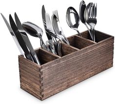 a wooden box filled with silverware and utensils