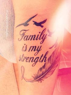 a woman's leg with the words family is my strength on it and birds flying around