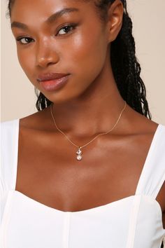 You'll always want to show off your accessories when you're wearing the Lulus Cherished Glitter Gold Rhinestone Pearl Pendant Necklace! Shiny, gold-toned metal shapes this elegant necklace that has a slender chain and a dangling pendant, which features a glittering square rhinestone and a luminous faux pearl. Lobster clasp closure. Necklace Measures 15. 25" Long With A 2" Extender Chain. 50% Brass, 25% Cubic Zirconia, 25% Acrylic Pearl. Imported. Lulus | Cherished Glitter Gold Rhinestone Pearl P