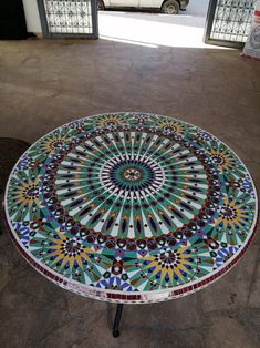 a table with a colorful mosaic design on it