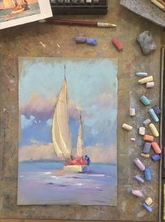 a painting of a sailboat in the ocean with pastel crayons and watercolors