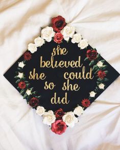 a graduation cap with flowers on it that says she believed she could so she did