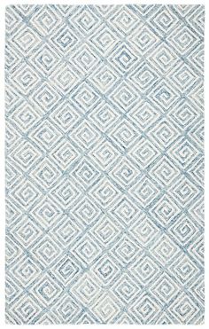 a blue and white rug with an abstract design