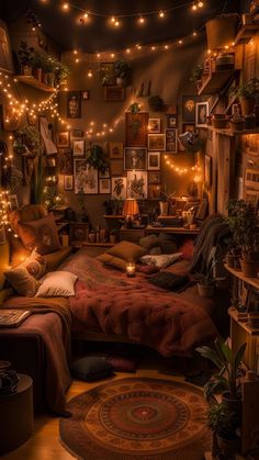 a bedroom with lights strung from the ceiling and pictures on the wall