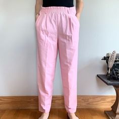 "Vintage 80s high waisted bright pink trousers. Paper bag style waist, straight leg fit with two front pockets. Theres no material tag, but it feels like a nice lightweight cotton. Perfect pants for spring and summer! There is some light pilling, but otherwise in excellent condition!  Size: 10 Brand: Separate Issue Measurements laying flat:  Waist: 15.5 inches Rise: 13 inches Inseam: 28 inches  Model measurements: Size small, 29\" waist, 35\" hips 5'7'', Pant and dress size 4-6" Pink Trousers, Perfect Pant, Pink Paper, Pink Pants, Bright Pink, Trousers Women, White Vintage, Paper Bag, Straight Leg