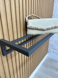 a towel rack is hanging on the wall