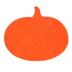 an orange piece of felt sitting on top of a white surface with the shape of a pumpkin