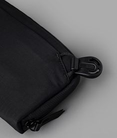 an empty black bag with zippers on it