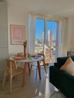 a living room filled with furniture and a large window