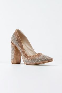 a women's high heeled shoe with glittery fabric and wooden block heels