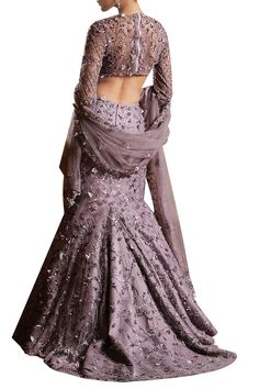 Showcasing an intricate embroidery of floral motifs, beads and sequins, this lilac net and raw silk lehenga set is a fabulous fashion for any occasion. It features a flattering fish cut lehenga skirt.
Fish cut lehenga skirt
Floral motifs
Bead and sequin embroidery - Aza Fashions Floor-length Fitted Choli With Intricate Embroidery, Floor-length Fitted Choli With Floral Embroidery, Fitted Floor-length Choli With Floral Embroidery, Fitted Embellished Gown For Diwali, Fitted Embellished Gown For Festivals, Elegant Floor-length Choli With Floral Embroidery, Fitted Embroidered Fabric For Reception, Fitted Embellished Embroidered Fabric For Eid, Embellished Fitted Embroidered Fabric For Eid