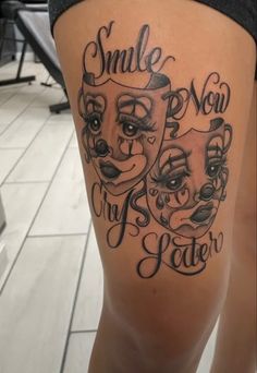 a woman's thigh with some tattoos on her legs and the words smile now, no matter