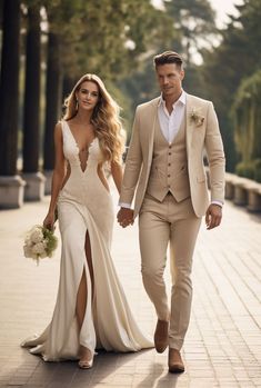 a man and woman in formal wear walking down the street holding hands with each other