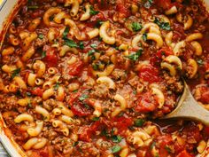 a large pot filled with pasta and sauce