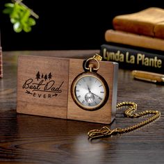 Personalized Engraved Wooden Pocket Watch with Stand - Father's Day Gift, Anniversary Gift for Him, Groomsmen Watch Description: Looking for a gift that will make a statement? Look no further than this incredible custom pocket watch! With its sleek design and stunning snakewood watch stand, it's sure to impress. Personalization: But that's not all - you can also personalize this pocket watch with your own message on the watch stand and/or back side of the watch. Make it a truly special gift by adding a heartfelt engraving. Perfect Gift for Various Occasions: This pocket watch is the perfect anniversary gift for him, a thoughtful Father's Day present, or a memorable token for milestones like a 21st birthday. It's also an ideal choice for groomsmen's gifts. No matter the occasion, this perso Brown Chronometer Watch For Gift, Brown Chronometer Watch As Gift, Gold Watch Accessories With Date Display For Gift, Timeless Gift Watches With Date Display, Timeless Watches With Date Display As A Gift, Timeless Watch With Date Display As Gift, Timeless Watch Accessories With Date Display As Gift, Chronograph Watch Accessories With Round Dial, Engraved Brown Watches For Gift