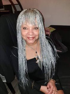 This mini box braids wig with bangs (aka baby face) is your go-to wig if you want to look classy. It is light weight and comfortable to wear, with an elastic band to secure it to the head. Please note that this style does not have baby hairs Color shown is a mix of gray and black, with more gray. Color can be customized. Back length is 22 inches but can also be customized. Processing time is 2 to 3 weeks Grey Knotless Box Braids, Grey Hair Braids Black Women, Bangs With Braids, Braided Hairstyles With Bangs, Mini Box Braids, Grey Box Braids, Grey Hair Braids, Box Braids Wig, Grey Hair Inspiration