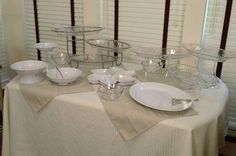 the table is set with dishes and silverware