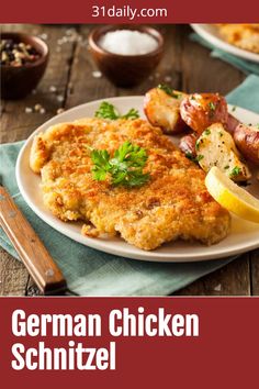 the german chicken schnitz is served on a white plate