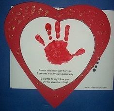 a heart shaped card with a handprint on it